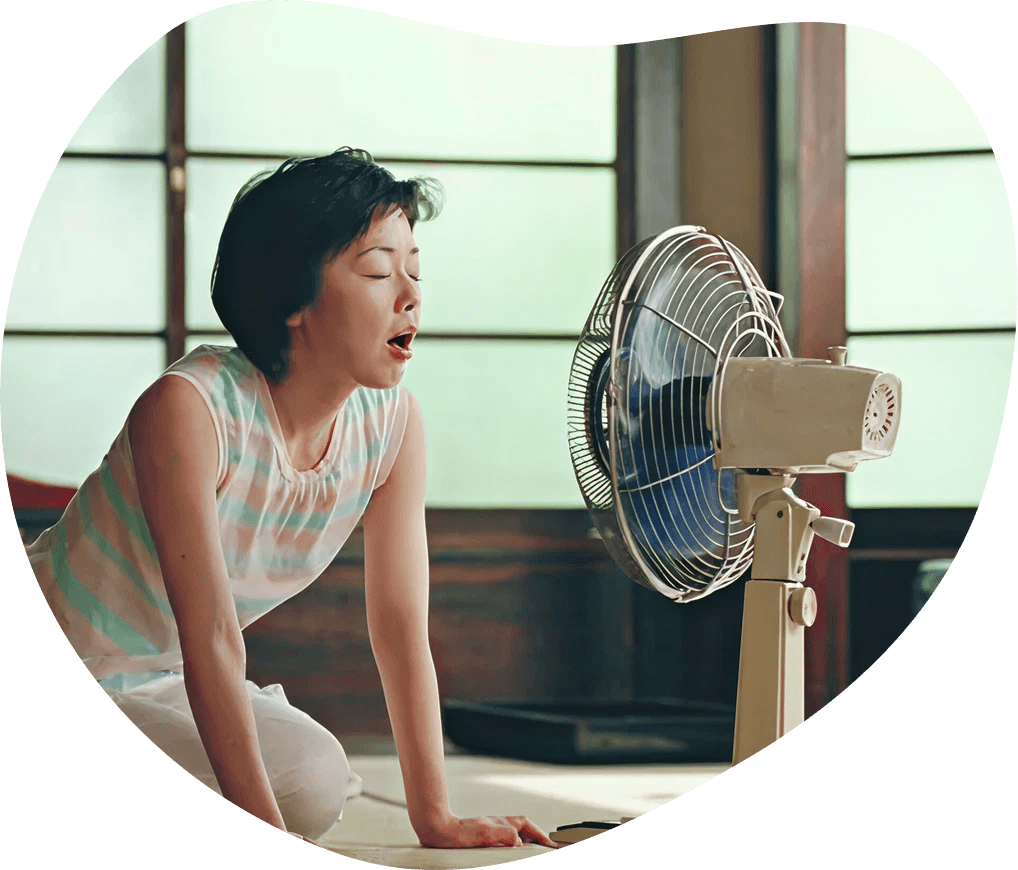 Exit case study — woman kneeling beside a vintage fan