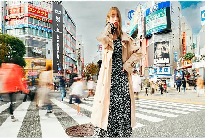 Person standing in a busy city intersection